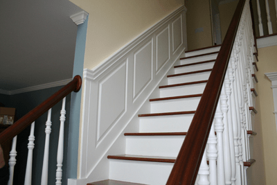 Wainscoting your staircase has never been easier! With a few key measurements we will custom fabricate your Wainscoting panels to the exact slope and diagonal length. The Wainscoting panels will fit perfectly and you will have a grand staircase leading to your foyer! Installed in Woodbury, Connecticut.