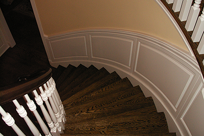 Cureved Classic Raised Panel Wainscoting Staircase