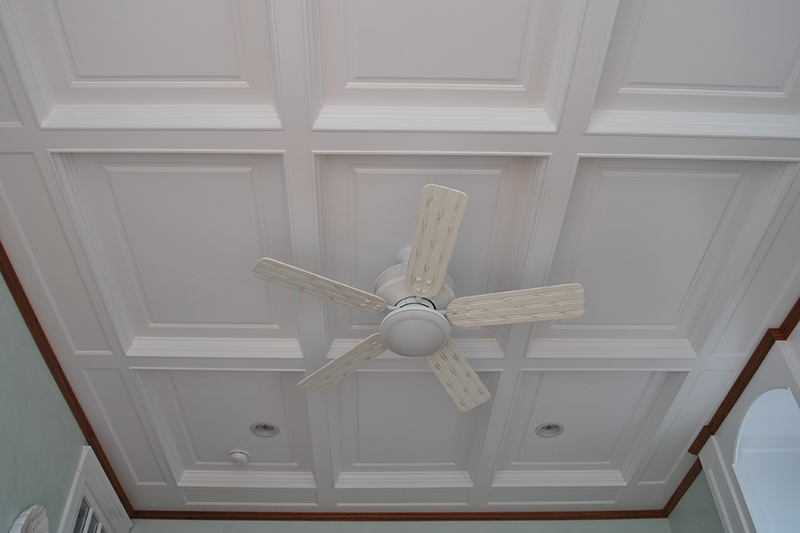 The coffered ceiling is painted white with Benjamin Moore Satin Impervo Paint