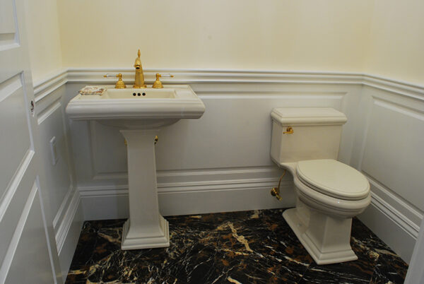 Very Wide Classic Raised Wainscoting in a Powder Room