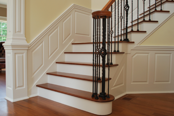 Classic Raised Panel Staircase with Column and custom triangle panel in foyer. Installed in Wolcott CT