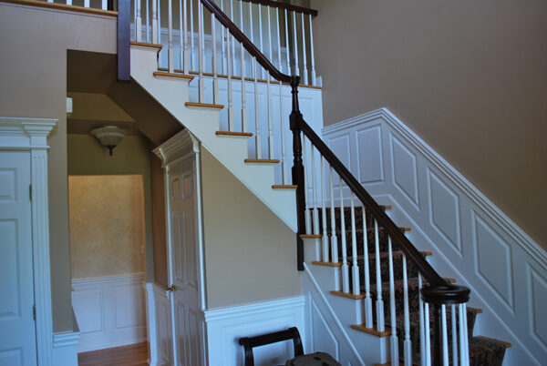 Raised Panels in foyer and staircase with a beautiful 3 1/4" poplar wood top cap molding